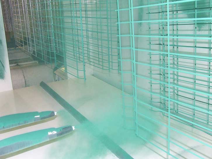 galvanized twin wire mesh fencing in the process of being polyester powder coated.