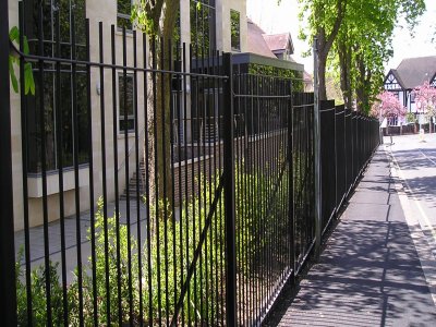 galvanized and powder coated mild steel vertical bar railings and sliding gates to BS 1722 Part 9.