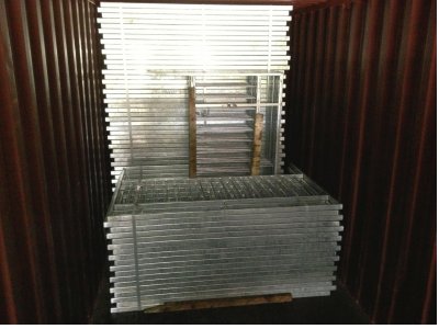galvanized pedestrian guardrail inside container awaiting shipment to Nigeria