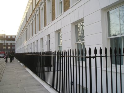 galvanized and powder coated vertical bar railings featuring spear head finial
